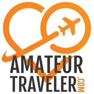 A orange heart icon with a plane going through the middle and the words AMATEUR TRAVELER.