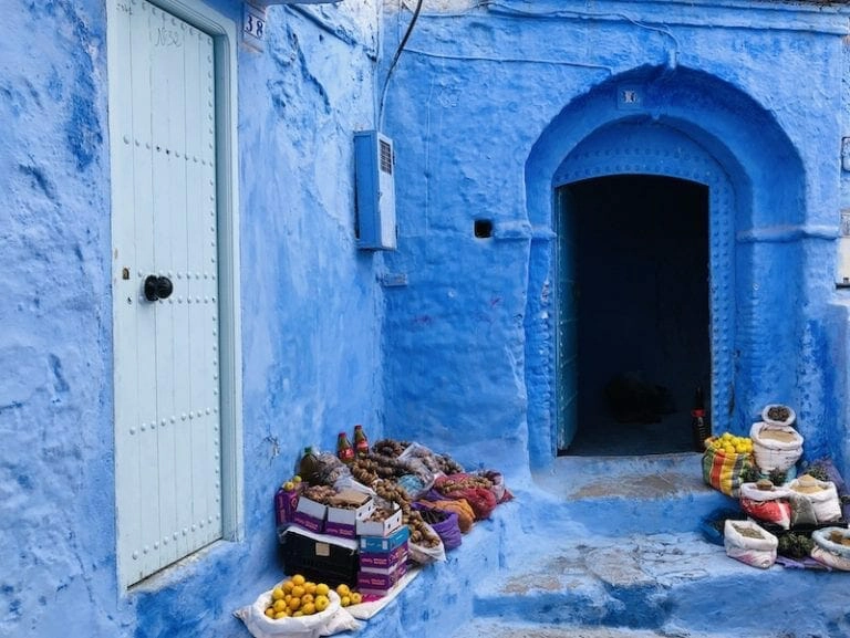 Blue pained walls by a doorway in Chefchaouen