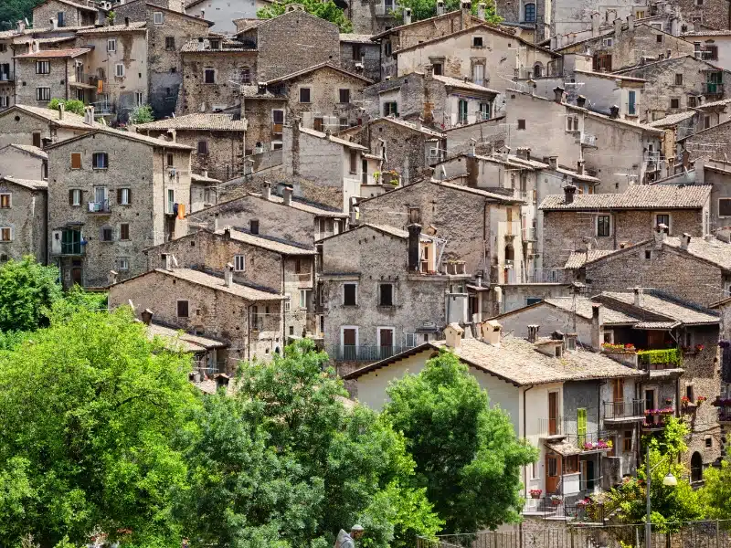 jumble of beige colored houses squashed together in a village